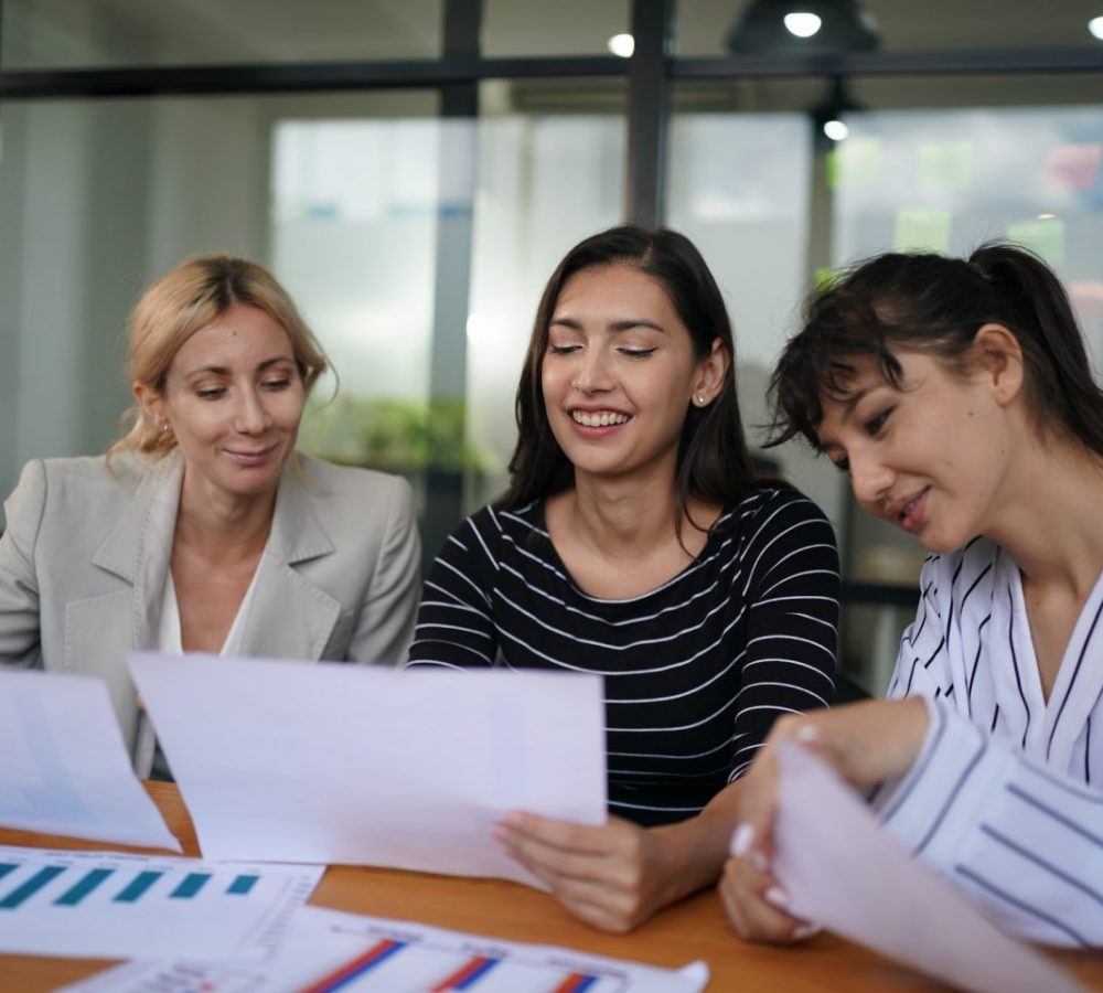 Businesswoman Making Business Presentation For Colleagues In Modern Office